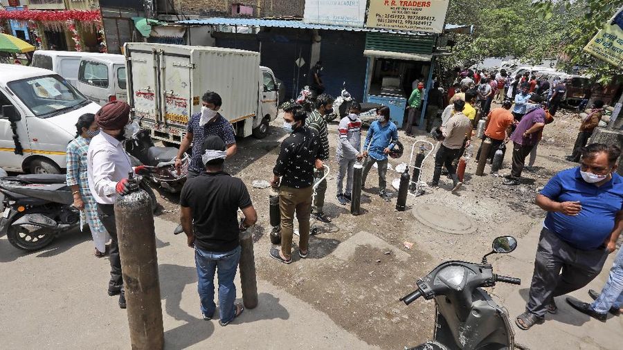 A relative of a person who died of COVID-19 breaks down during cremation in Jammu, India, Sunday, April 25, 2021. India’s crematoriums and burial grounds are being overwhelmed by the devastating new surge of infections tearing through the populous country with terrifying speed, depleting the supply of life-saving oxygen to critical levels and leaving patients to die while waiting in line to see doctors. (AP Photo/Channi Anand)