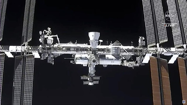This image made from NASA TV shows the international space station, seen from the SpaceX Crew Dragon spacecraft Saturday, April 24, 2021. The recycled SpaceX capsule carrying four astronauts has arrived at the International Space Station, a day after launching from Florida. (NASA via AP)
