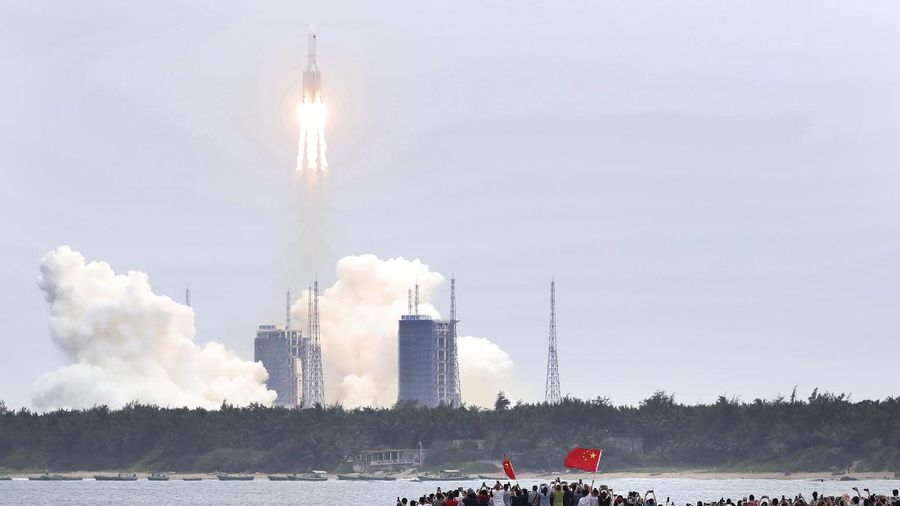 In this photo released by China's Xinhua News Agency, a Long March 5B rocket carrying a module for a Chinese space station lifts off from the Wenchang Spacecraft Launch Site in Wenchang in southern China's Hainan Province, Thursday, April 29, 2021. China has launched the core module on Thursday for its first permanent space station that will host astronauts long-term. (Jin Liwang/Xinhua via AP)