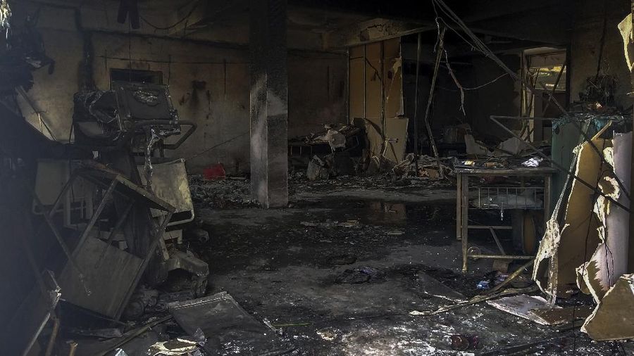 Charred furniture and other items are seen after a deadly fire at the Welfare Hospital in Bharuch, western India, Saturday, May 1, 2021. The fire in a COVID-19 ward of the hospital killed multiple patients early Saturday, as the country grappling with the worst outbreak yet steps up a vaccination drive for all its adults even though some states say don't have enough jabs.  (AP Photo/Viral Rana)