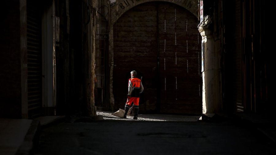 A man walks on deserted Eminonu market with shops closed, Friday, April 30, 2021, on the first day of a tight lockdown to help protect from the spread of the coronavirus. Turkish President Recep Tayyip Erdogan imposed the new lockdown restrictions that will last until May 17, after COVID-19 infections and fatalities hit record high levels. Under the restrictions -- which spans the holy Muslim month of Ramadan, as well as the three-day Eid holiday - residents are banned from leaving their homes except to shop for groceries or to meet other essential needs.(AP Photo/Emrah Gurel)