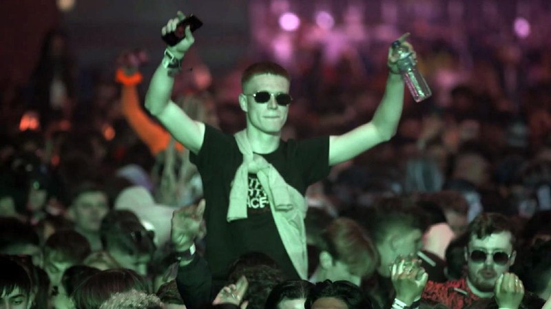 Revellers at the Circus Nightclub at Bramley-Moore Dock, in Liverpool, England, Friday, April 30, 2021. Several thousand music fans have become the first people in Britain in more than a year to legally dance, drink and listen to music in a nightclub. A gig at a warehouse in Liverpool, England that started on Friday afternoon is one of a series of pilot events sponsored by the government and closely monitored by public health officials. The 3,000 attendee, will be tested for the virus before and after the event. (Richard McCarthy/PA via AP)