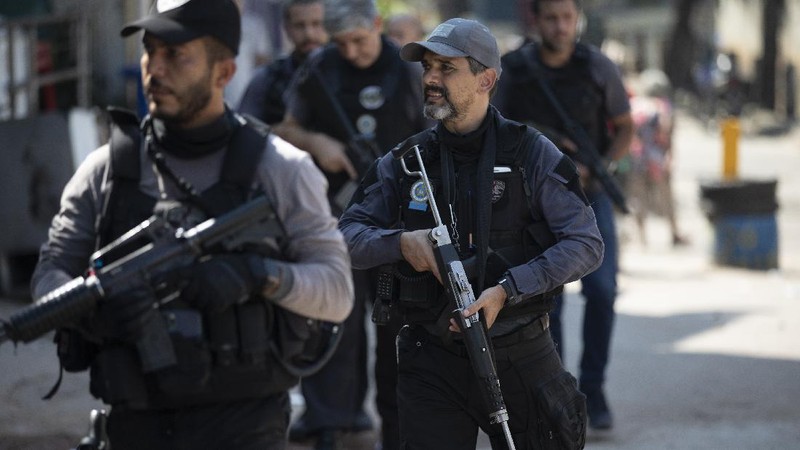 Police get out of an armored vehicle during an operation against alleged drug traffickers in the Jacarezinho favela of Rio de Janeiro, Brazil, Thursday, May 6, 2021. (AP Photo/Silvia Izquierdo)