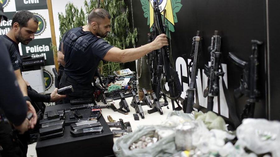 Police get out of an armored vehicle during an operation against alleged drug traffickers in the Jacarezinho favela of Rio de Janeiro, Brazil, Thursday, May 6, 2021. (AP Photo/Silvia Izquierdo)