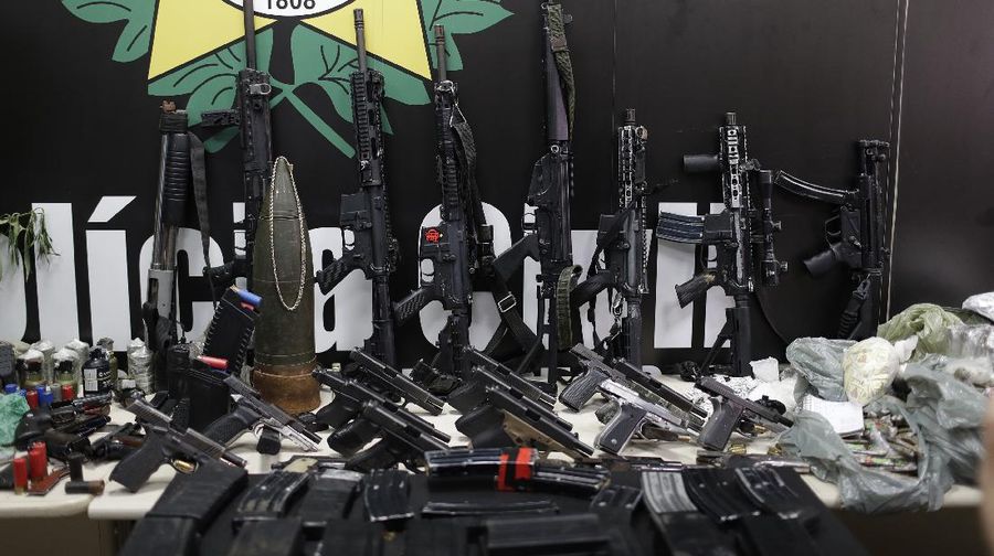 Police get out of an armored vehicle during an operation against alleged drug traffickers in the Jacarezinho favela of Rio de Janeiro, Brazil, Thursday, May 6, 2021. (AP Photo/Silvia Izquierdo)