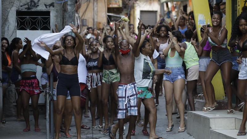 Police get out of an armored vehicle during an operation against alleged drug traffickers in the Jacarezinho favela of Rio de Janeiro, Brazil, Thursday, May 6, 2021. (AP Photo/Silvia Izquierdo)