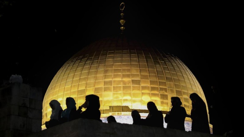Palestinian Muslim worshippers pray during the Laylat al-Qadr, or the night of destiny, in the holy fasting month of Ramadan, in front of the Dome of the Rock Mosque at the Al Aqsa Mosque compound in Jerusalem's Old City Saturday, May 8, 2021. (AP Photo/Mahmoud Illean)