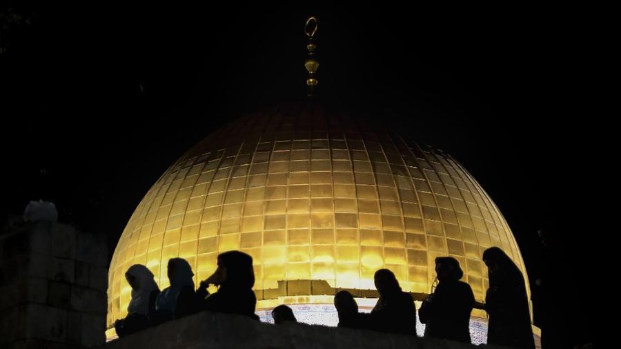 Palestinian Muslim worshippers pray during the Laylat al-Qadr, or the night of destiny, in the holy fasting month of Ramadan, in front of the Dome of the Rock Mosque at the Al Aqsa Mosque compound in Jerusalem's Old City Saturday, May 8, 2021. (AP Photo/Mahmoud Illean)