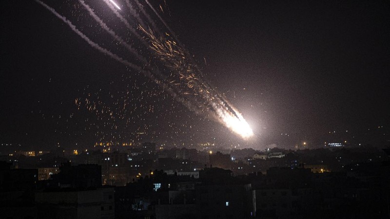 Rockets are launched from the Gaza Strip towards Israel, Monday, May. 10, 2021. Hamas militants fired dozens of rockets into Israel on Monday, including a barrage that set off air raid sirens as far away as Jerusalem, after hundreds of Palestinians were hurt in clashes with Israeli police at a flashpoint religious site in the contested holy city. (AP Photo/Khalil Hamra)