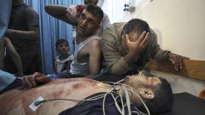 Rockets are launched from the Gaza Strip towards Israel, Monday, May. 10, 2021. Hamas militants fired dozens of rockets into Israel on Monday, including a barrage that set off air raid sirens as far away as Jerusalem, after hundreds of Palestinians were hurt in clashes with Israeli police at a flashpoint religious site in the contested holy city. (AP Photo/Khalil Hamra)