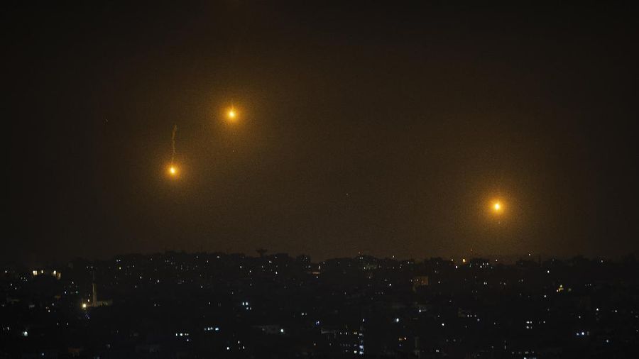Rockets are launched from the Gaza Strip towards Israel, Monday, May. 10, 2021. Hamas militants fired dozens of rockets into Israel on Monday, including a barrage that set off air raid sirens as far away as Jerusalem, after hundreds of Palestinians were hurt in clashes with Israeli police at a flashpoint religious site in the contested holy city. (AP Photo/Khalil Hamra)