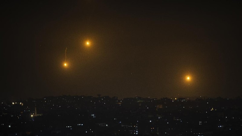 Rockets are launched from the Gaza Strip towards Israel, Monday, May. 10, 2021. Hamas militants fired dozens of rockets into Israel on Monday, including a barrage that set off air raid sirens as far away as Jerusalem, after hundreds of Palestinians were hurt in clashes with Israeli police at a flashpoint religious site in the contested holy city. (AP Photo/Khalil Hamra)