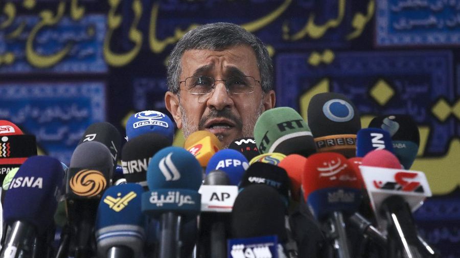Former President Mahmoud Ahmadinejad speaks with the media after registering his name as a candidate for the June 18 presidential elections at elections headquarters of the Interior Ministry in Tehran, Iran, Wednesday, May 12, 2021. The country's former firebrand president will run again for office in upcoming elections in June. The Holocaust-denying Ahmadinejad has previously been banned from running for the presidency by Supreme Leader Ayatollah Ali Khamenei in 2017, although then, he registered anyway. (AP Photo/Vahid Salemi)