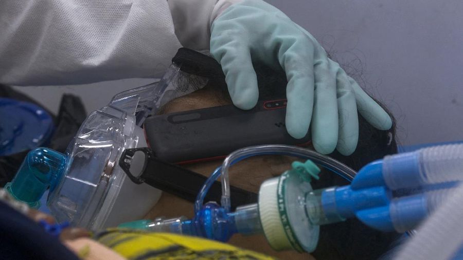 Susheela Singh, 72, whose oxygen level is low waits inside an ambulance outside a COVID-19 hospital that was set up at a Sikh Gurdwara in New Delhi, India, Monday, May 10, 2021. She was referred to a bigger hospital in the city. (AP Photo/Ishant Chauhan)