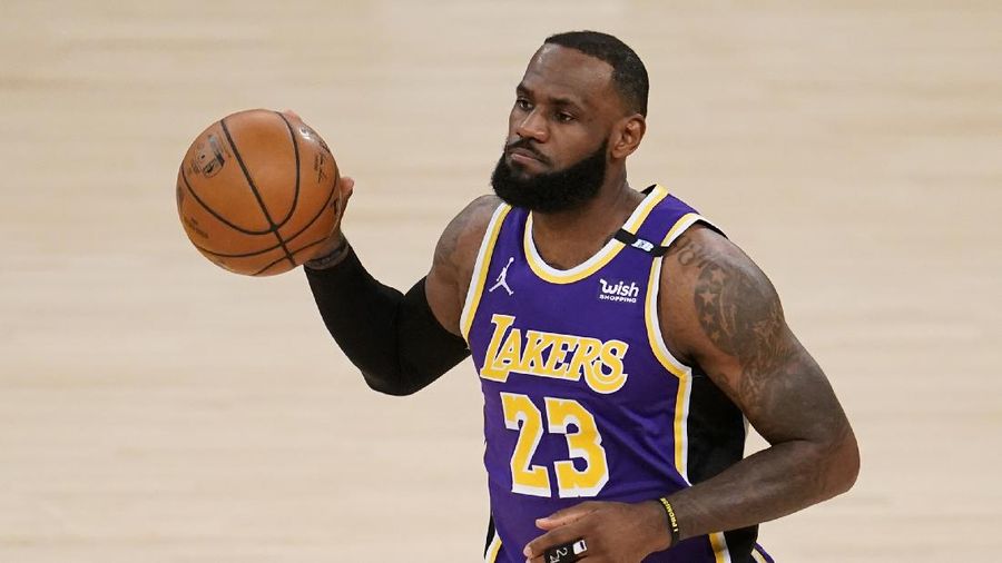 Los Angeles Lakers' LeBron James dribble the ball during the first half of the team's NBA basketball game against the Sacramento Kings on Friday, April 30, 2021, in Los Angeles. (AP Photo/Marcio Jose Sanchez)