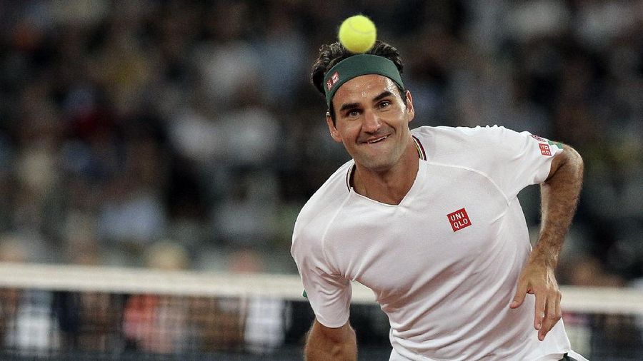 Roger Federer in action during the exhibition tennis match against Rafael Nadal held at the Cape Town Stadium in Cape Town, South Africa, Friday Feb. 7, 2020. (AP Photo/Halden Krog)