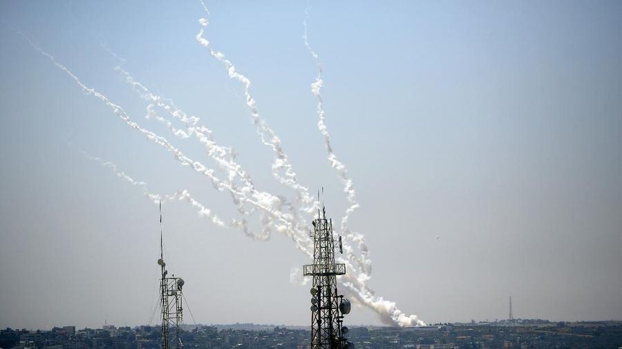 Rockets are launched from Gaza Strip to Israel, Thursday, May 13, 2021. Israeli airstrikes killed multiple senior Hamas military figures Wednesday and toppled a pair of high-rise towers housing Hamas facilities. (AP Photo/Hatem Moussa)