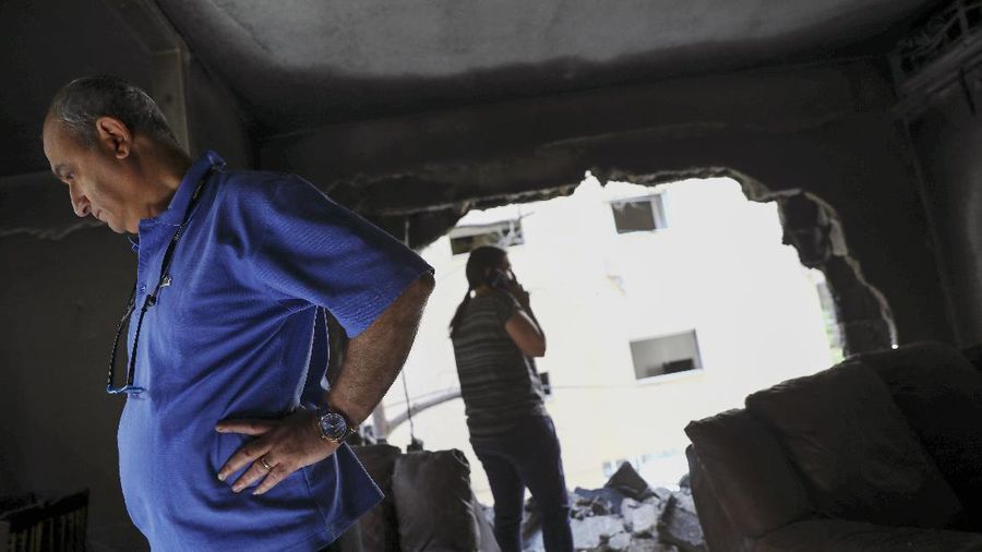 An Israeli artillery unit fires toward targets in Gaza Strip, at the Israeli Gaza border, Thursday, May 13, 2021. (AP Photo/Ariel Schalit)