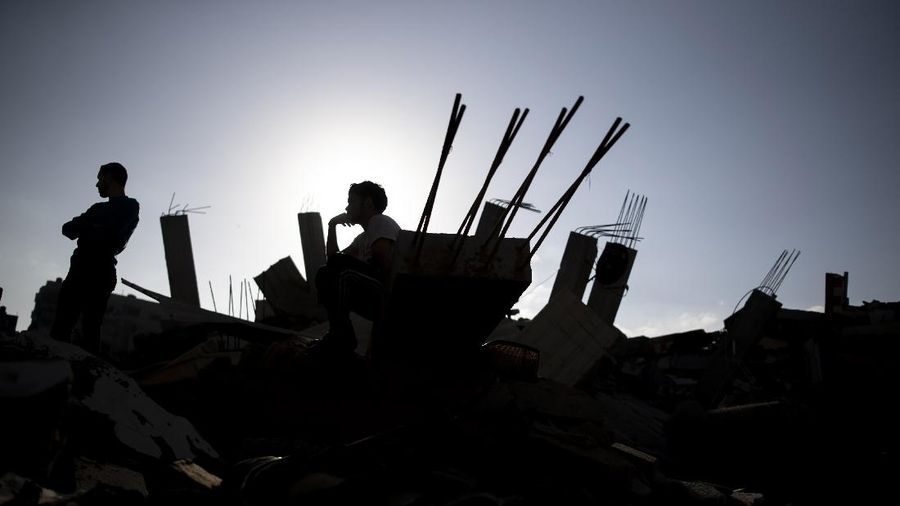 An Israeli artillery unit fires toward targets in Gaza Strip, at the Israeli Gaza border, Thursday, May 13, 2021. (AP Photo/Ariel Schalit)