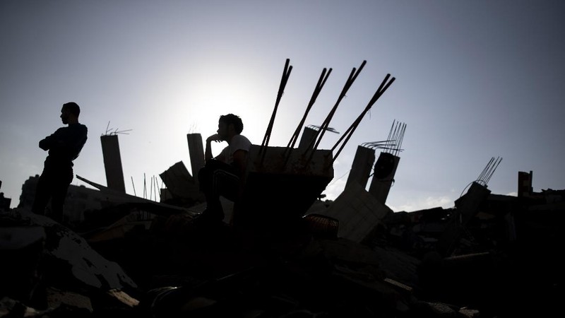 An Israeli artillery unit fires toward targets in Gaza Strip, at the Israeli Gaza border, Thursday, May 13, 2021. (AP Photo/Ariel Schalit)