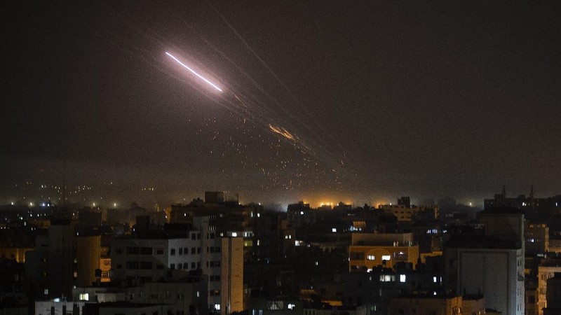 An Israeli artillery unit fires toward targets in Gaza Strip, at the Israeli Gaza border, Thursday, May 13, 2021. (AP Photo/Ariel Schalit)