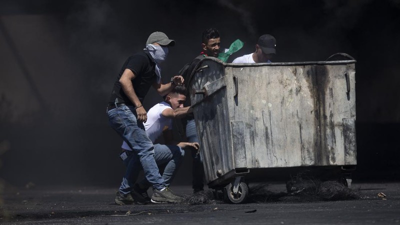 Israeli police deploy a water cannon to disperse protesters in the Sheikh Jarrah neighborhood of east Jerusalem, where several Palestinian families are under imminent threat of forcible eviction from their homes, Friday, May 14, 2021. (AP Photo/ Mahmoud Illean)