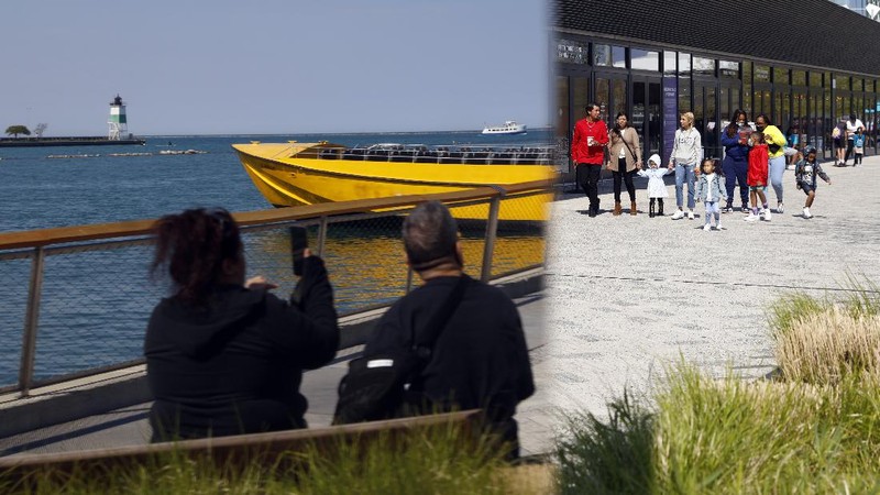 People enjoy their time in a wave swinger Friday, May 14, 2021 at Chicago's Navy Pier. The U.S. Centers for Disease Control and Prevention eased its guidelines, saying fully vaccinated people can resume activities without wearing masks. (AP Photo/Shafkat Anowar)