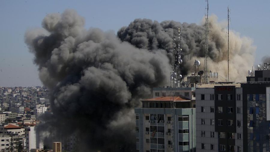 A view of a 11-story building housing AP office and other media in Gaza City is seen moments after Israeli warplanes demolished it, Saturday, May 15, 2021. (AP Photo/Hatem Moussa)
