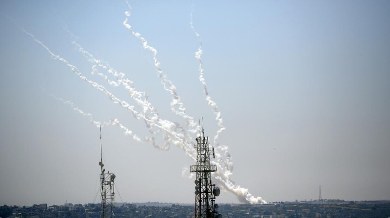 Rockets are launched from Gaza Strip to Israel, Thursday, May 13, 2021. Israeli airstrikes killed multiple senior Hamas military figures Wednesday and toppled a pair of high-rise towers housing Hamas facilities. (AP Photo/Hatem Moussa)