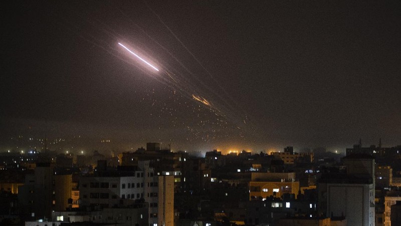 Rockets are launched from Gaza Strip to Israel, Thursday, May 13, 2021. Israeli airstrikes killed multiple senior Hamas military figures Wednesday and toppled a pair of high-rise towers housing Hamas facilities. (AP Photo/Hatem Moussa)