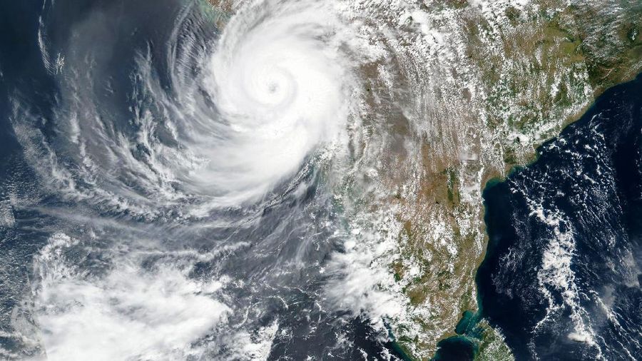 This Monday, May, 17, 2021, satellite image released NASA shows Cyclone Tauktae approaching India's western coast. The powerful cyclone that emerged in the Arabian Sea made landfall on India's western coast on Monday. (NASA Worldview, Earth Observing System Data and Information System (EOSDIS) via AP)