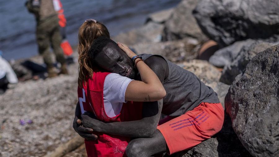 A migrant is rescued by a Spanish Civil guard boat near the border of Morocco and Spain, on Tuesday, May 18, 2021. Spain deployed its military to the Moroccan border Tuesday as thousands of migrants jumped fences or swam onto European soil for the second day in a row after Rabat loosened border controls amid a deepening diplomatic spat. Morocco's loosened border watch came after Spain decided to grant entry for medical treatment to the chief of a militant group that fights for the independence of Western Sahara. Morocco annexed the sprawling region on the west coast of Africa in 1975. (AP Photo/Bernat Armangue)
