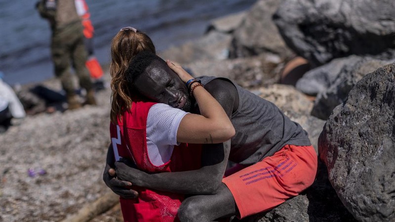 A migrant is rescued by a Spanish Civil guard boat near the border of Morocco and Spain, on Tuesday, May 18, 2021. Spain deployed its military to the Moroccan border Tuesday as thousands of migrants jumped fences or swam onto European soil for the second day in a row after Rabat loosened border controls amid a deepening diplomatic spat. Morocco's loosened border watch came after Spain decided to grant entry for medical treatment to the chief of a militant group that fights for the independence of Western Sahara. Morocco annexed the sprawling region on the west coast of Africa in 1975. (AP Photo/Bernat Armangue)