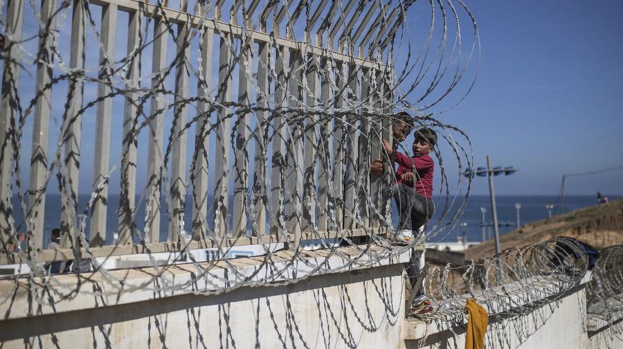 A migrant is rescued by a Spanish Civil guard boat near the border of Morocco and Spain, on Tuesday, May 18, 2021. Spain deployed its military to the Moroccan border Tuesday as thousands of migrants jumped fences or swam onto European soil for the second day in a row after Rabat loosened border controls amid a deepening diplomatic spat. Morocco's loosened border watch came after Spain decided to grant entry for medical treatment to the chief of a militant group that fights for the independence of Western Sahara. Morocco annexed the sprawling region on the west coast of Africa in 1975. (AP Photo/Bernat Armangue)