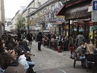 Customers drink beers at cafe terraces in Paris, Wednesday, May, 19, 2021. It's a grand day for the French. Cafe and restaurant terraces reopened Wednesday after a six-month coronavirus shutdown deprived residents of the essence of French "joie de vi