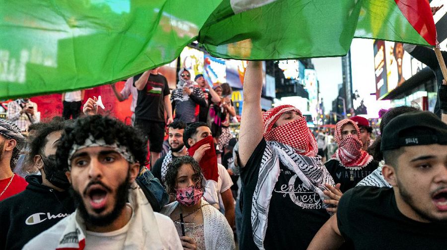 Supporters of the Palestinians march in New York Thursday, May 20, 2021. Israel and Hamas announced a cease-fire, ending a bruising 11-day war that caused widespread destruction in the Gaza Strip and brought life in much of Israel to a standstill. (AP Photo/Craig Ruttle)