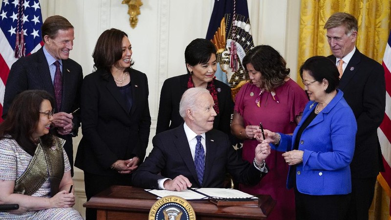 President Joe Biden signs the COVID-19 Hate Crimes Act, in the East Room of the White House, Thursday, May 20, 2021, in Washington. (AP Photo/Evan Vucci)