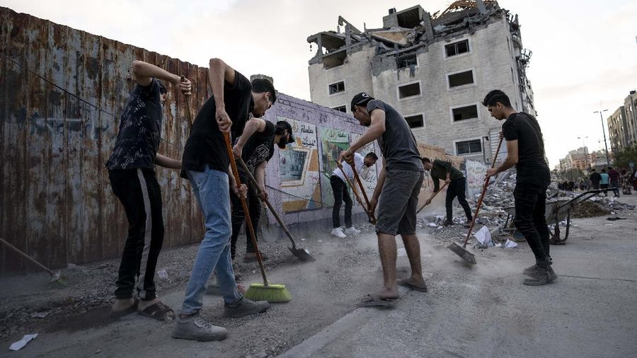 Kesepakatan gencatan senjata mengakhiri aksi saling serang anĂ¥tara Israel dan Palestina di jalur Gaza. (AP/John Minchillo)