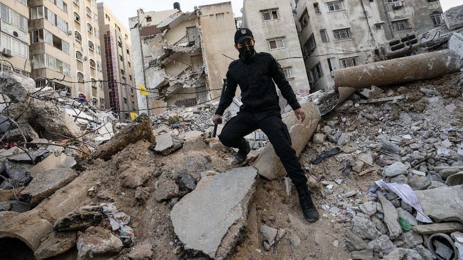 Kesepakatan gencatan senjata mengakhiri aksi saling serang anåtara Israel dan Palestina di jalur Gaza. (AP/John Minchillo)