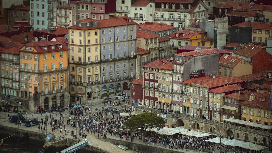 Police moves in to stop a scuffle that started among Manchester City supporters drinking by the Douro river bank in Porto, Portugal, Friday, May 28, 2021. English clubs Manchester City and Chelsea will play the Champions League soccer final in Porto on Saturday. (AP Photo/Luis Vieira)