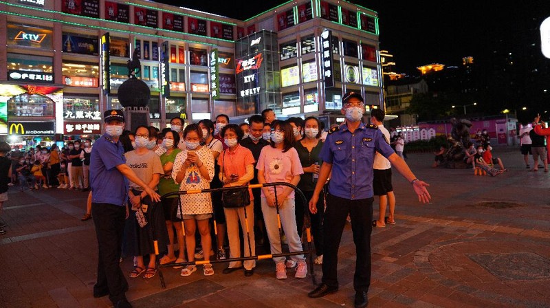 Residents line up for coronavirus testing in the Liwan District in Guangzhou in southern China's Guangdong province on Wednesday May 26, 2021. The southern Chinese city of Guangzhou shut down a neighborhood and ordered its residents to stay home Saturday for door-to-door coronavirus testing following an upsurge in infections that has rattled authorities.(AP Photo)