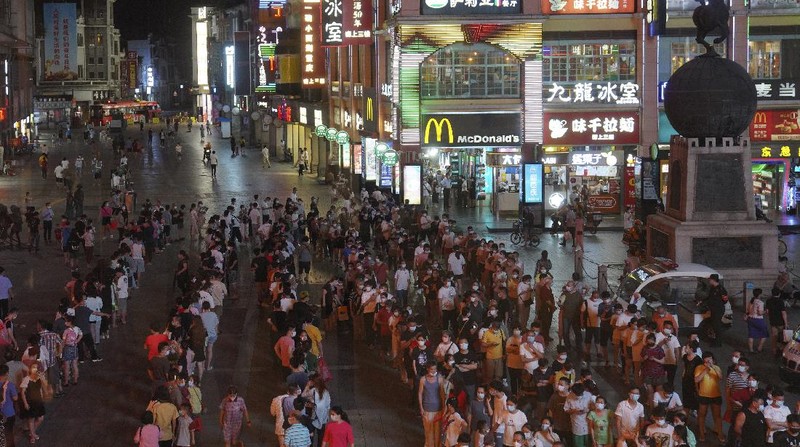 Residents line up for coronavirus testing in the Liwan District in Guangzhou in southern China's Guangdong province on Wednesday May 26, 2021. The southern Chinese city of Guangzhou shut down a neighborhood and ordered its residents to stay home Saturday for door-to-door coronavirus testing following an upsurge in infections that has rattled authorities.(AP Photo)