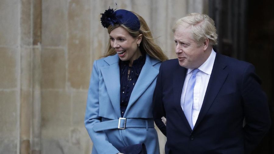 Britain's Prime Minister Boris Johnson and his partner Carrie Symonds leave after attending the annual Commonwealth Day service at Westminster Abbey in London, Monday, March 9, 2020. The annual service, organised by the Royal Commonwealth Society, is the largest annual inter-faith gathering in the United Kingdom. (AP Photo/Kirsty Wigglesworth)