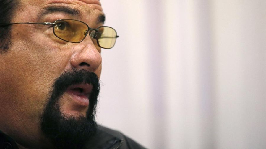 Hollywood actor and producer Steven Seagal speaks during talks with Serbian Prime Minister Aleksandar Vucic, in Belgrade, Serbia, Tuesday, Jan. 12, 2015. Serbia has granted citizenship to Seagal on Monday. (AP Photo/Darko Vojinovic)
