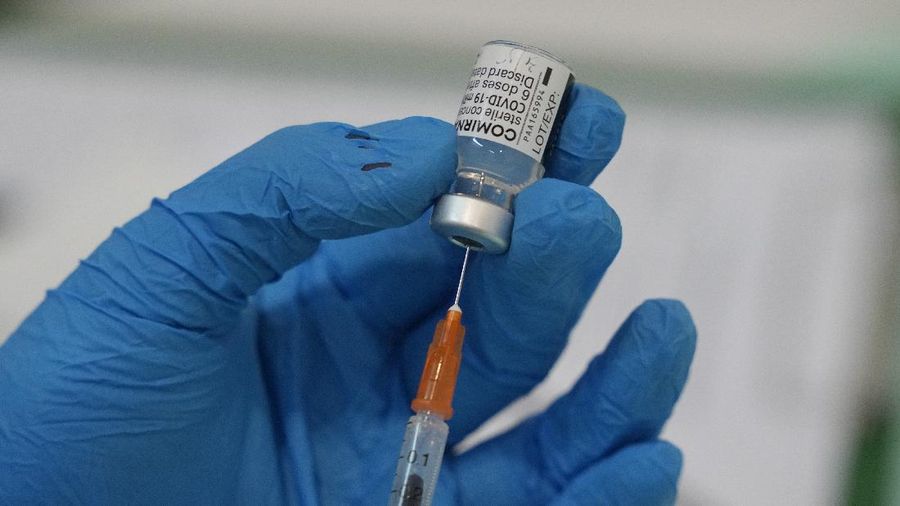 A man receives the Pfizer's vaccine for the coronavirus at a vaccination center in Kuala Lumpur, Malaysia, Monday, May 31, 2021. An exhibition center in Malaysia has been turned into the country's first mega vaccination center as the government aims to speed up inoculations amid a sharp spike in infections. (AP Photo/Vincent Thian)