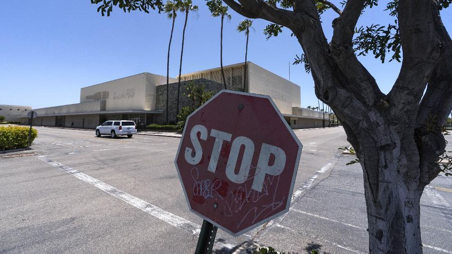 This Thursday, May 27, 2021, photo shows the closed Sears in Buena Park Mall in Buena Park, Calif. California state lawmakers are grappling with a particularly 21st-century problem: What to do with the growing number of shopping malls and big-box retail stores left empty by consumers shifting their purchases to the web. A possible answer in crowded California cities is to build housing on these sites, which already have ample parking and are close to existing neighborhoods. Even before the pandemic, big-box retail stores struggled to adapt as more people began buying things online. In 2019, after purchasing Sears and Kmart, Transformco closed 96 stores across the country, 29 in California. (AP Photo/Damian Dovarganes)