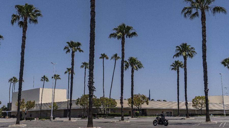 This Thursday, May 27, 2021, photo shows the closed Sears in Buena Park Mall in Buena Park, Calif. California state lawmakers are grappling with a particularly 21st-century problem: What to do with the growing number of shopping malls and big-box retail stores left empty by consumers shifting their purchases to the web. A possible answer in crowded California cities is to build housing on these sites, which already have ample parking and are close to existing neighborhoods. Even before the pandemic, big-box retail stores struggled to adapt as more people began buying things online. In 2019, after purchasing Sears and Kmart, Transformco closed 96 stores across the country, 29 in California. (AP Photo/Damian Dovarganes)