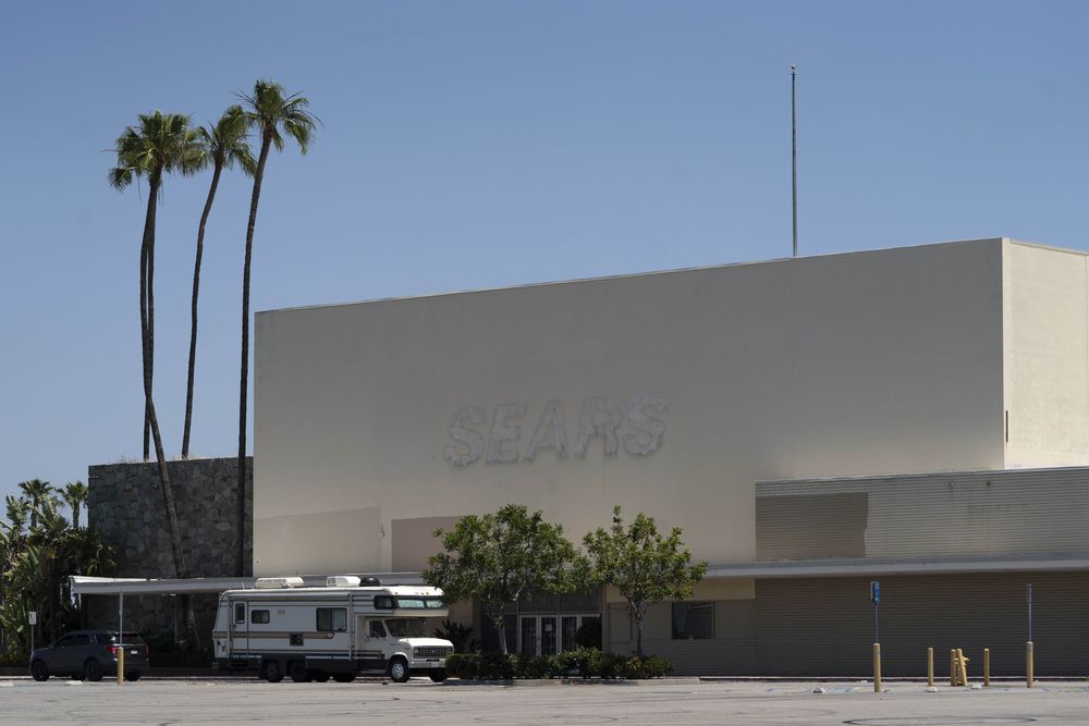 This Thursday, May 27, 2021, photo shows the closed Sears in Buena Park Mall in Buena Park, Calif. California state lawmakers are grappling with a particularly 21st-century problem: What to do with the growing number of shopping malls and big-box retail stores left empty by consumers shifting their purchases to the web. A possible answer in crowded California cities is to build housing on these sites, which already have ample parking and are close to existing neighborhoods. (AP Photo/Damian Dovarganes)