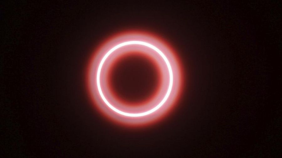 An annular solar eclipse is seen though safety glass from Siak, Riau province, Indonesia, Thursday, Thursday, Dec. 26, 2019. People along a swath of southern Asia gazed at the sky in marvel on Thursday at a 