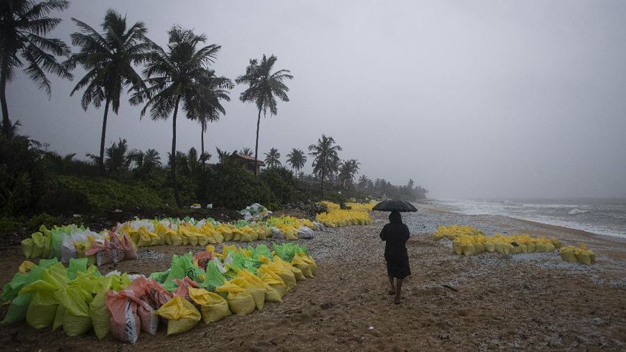 This photo provided by Sri Lankan Air Force shows the sinking MV X-Press Pearl at Kapungoda where it is anchored off Colombo port, Sri Lanka, Wednesday, June 2, 2021. Salvage experts were attempting to tow the fire-stricken container ship that had been loaded with chemicals into the deep sea as the vessel started to sink Wednesday. Water submerged the MV X-Press Pearl's quarterdeck a day after firefighters extinguished a blaze that had been burning for 12 days. (Sri Lanka Air Force via AP)